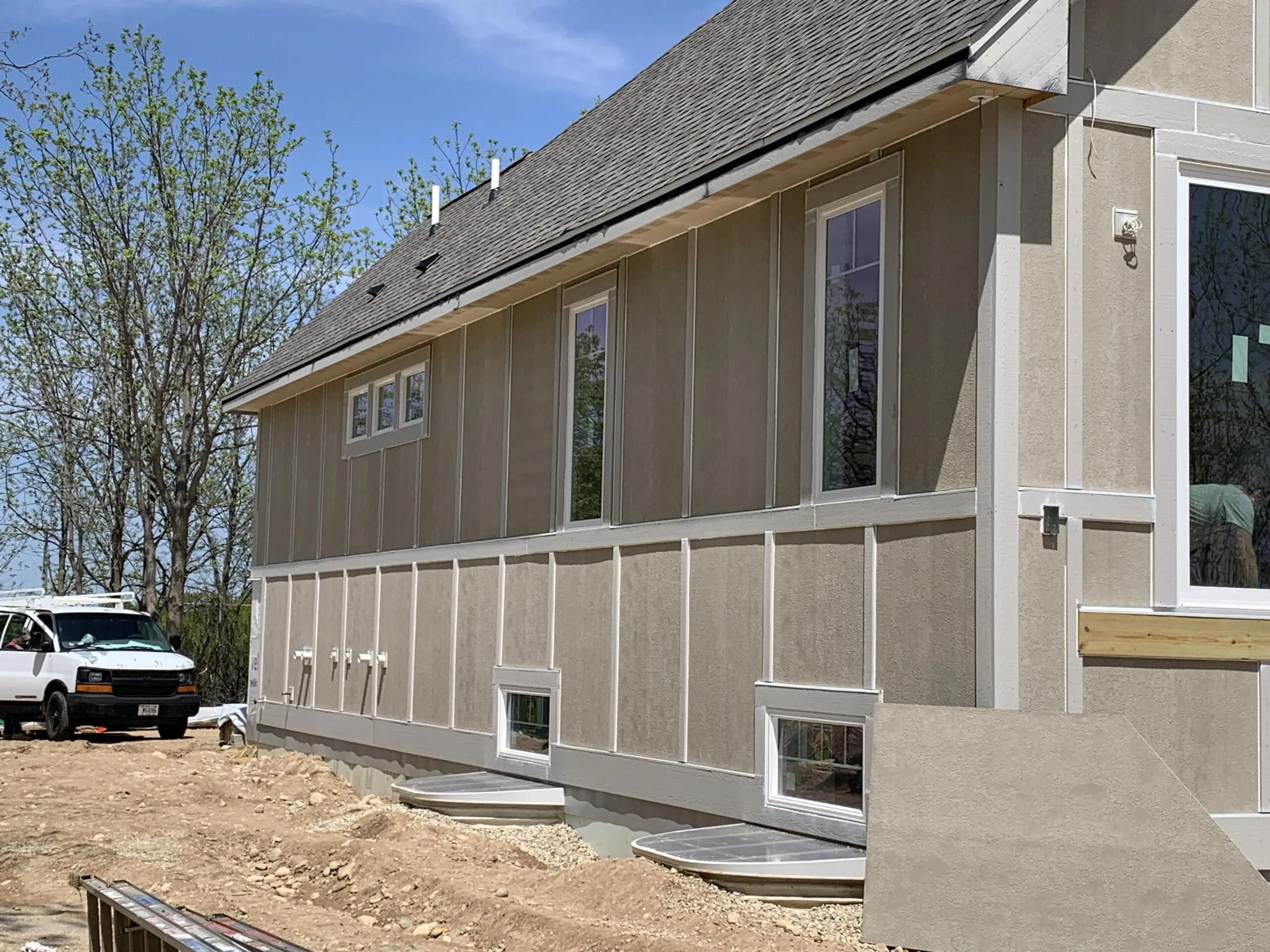 Scaled siding job on the side of a house in Pewaukee, WI done by L.H. Krueger and Son