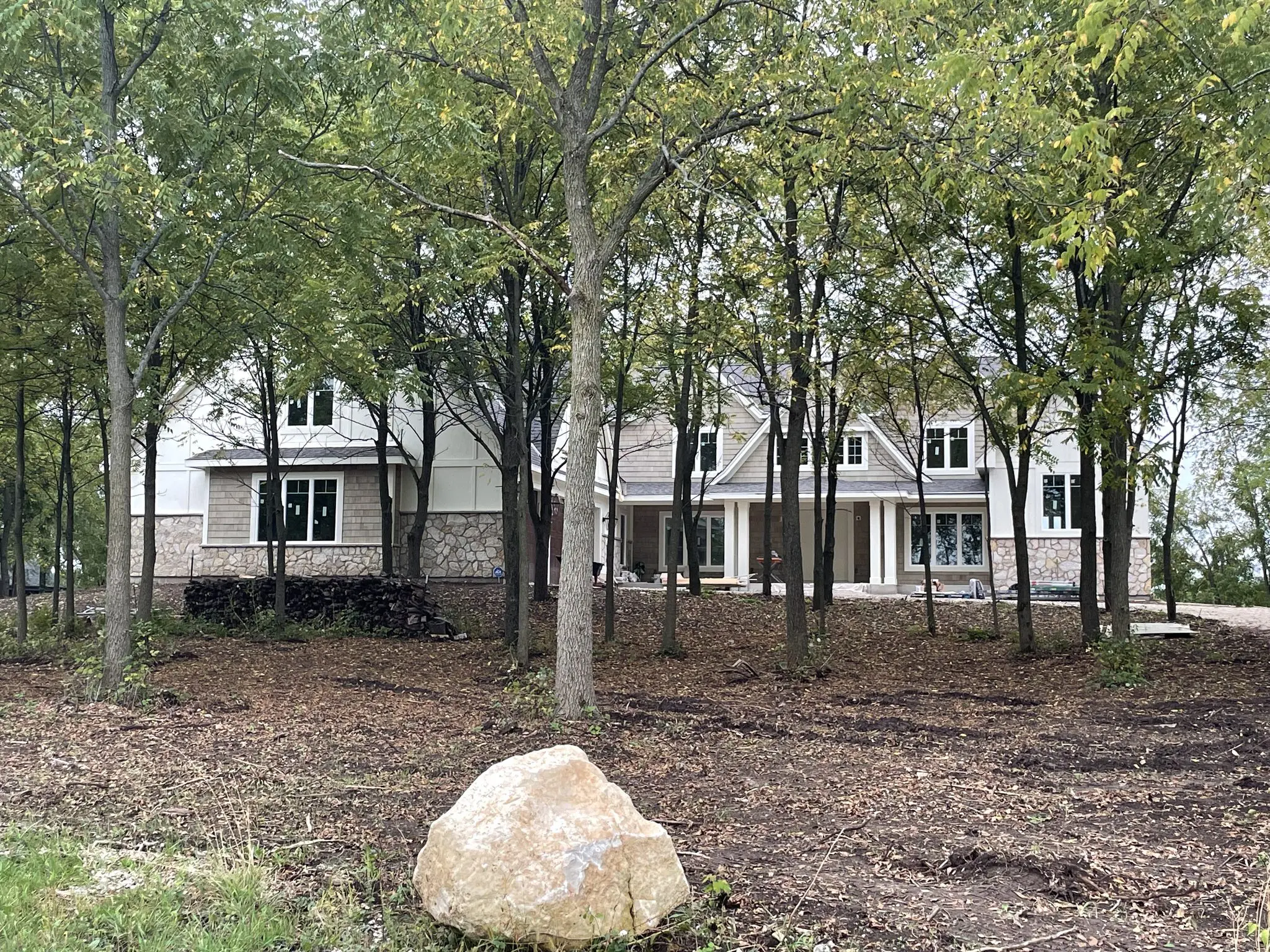 Front yard of finished siding job on a house in Pewaukee, WI done by L.H. Krueger and Son