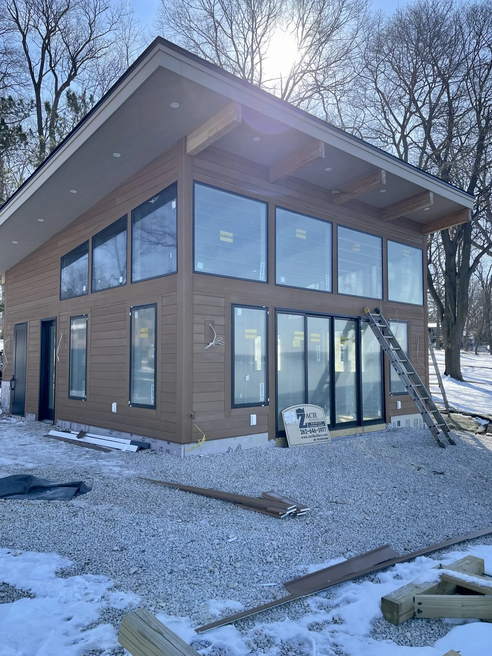 Completed siding on a boathouse in Pewaukee, WI by L.H. Krueger and Son