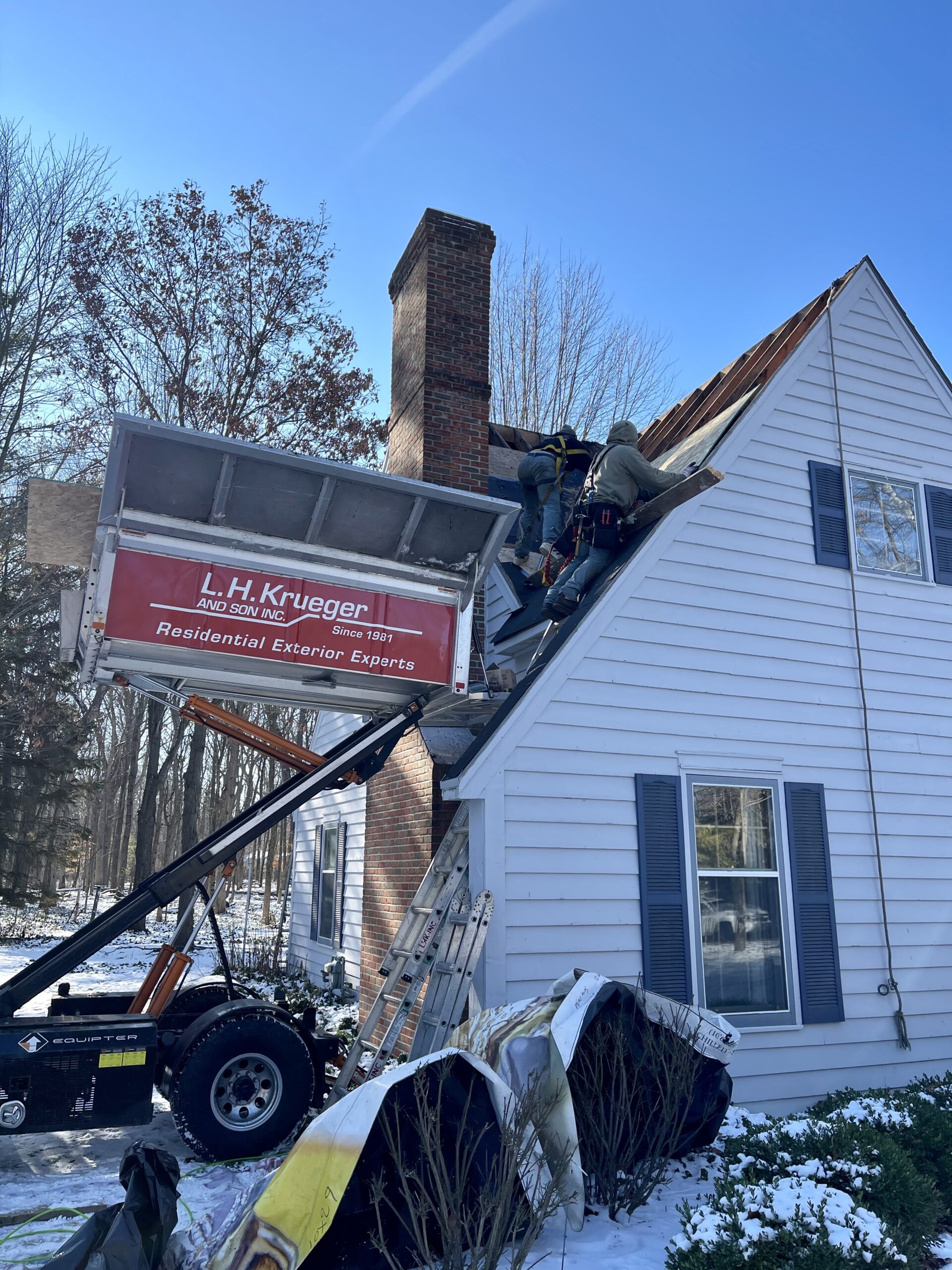 L.H. Krueger and Son working on re-roofing a home in Delafield, WI
