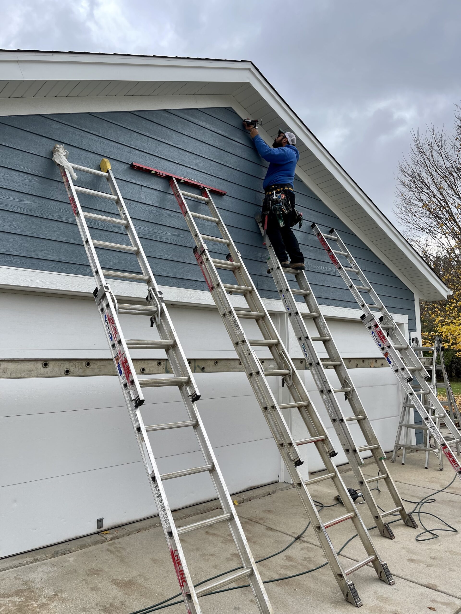 In progress residing job above garage door on a home in Nashotah, WI done by L.H. Krueger and Son