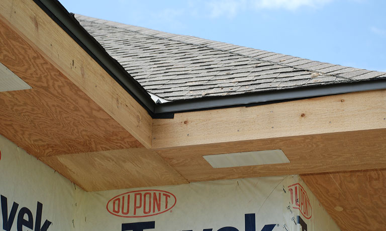 Roofing and soffit installation on a new home build
