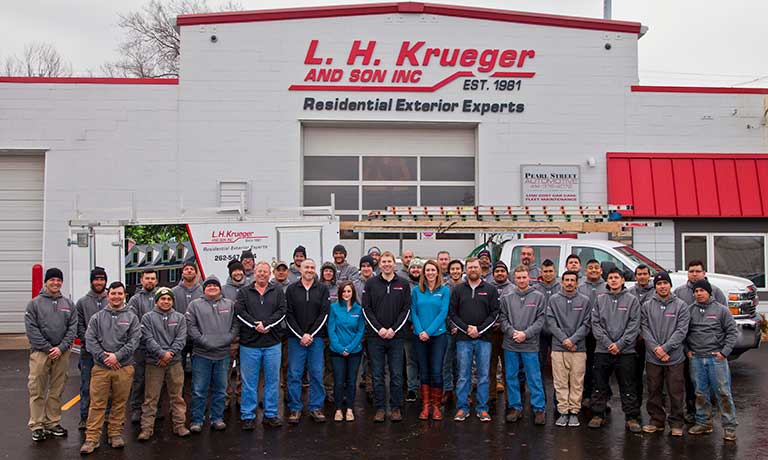 The L.H. Krueger Team in front of headquarters