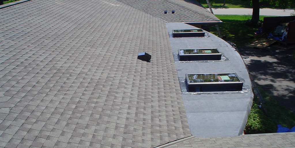 Installation of rubber roofing and skylights