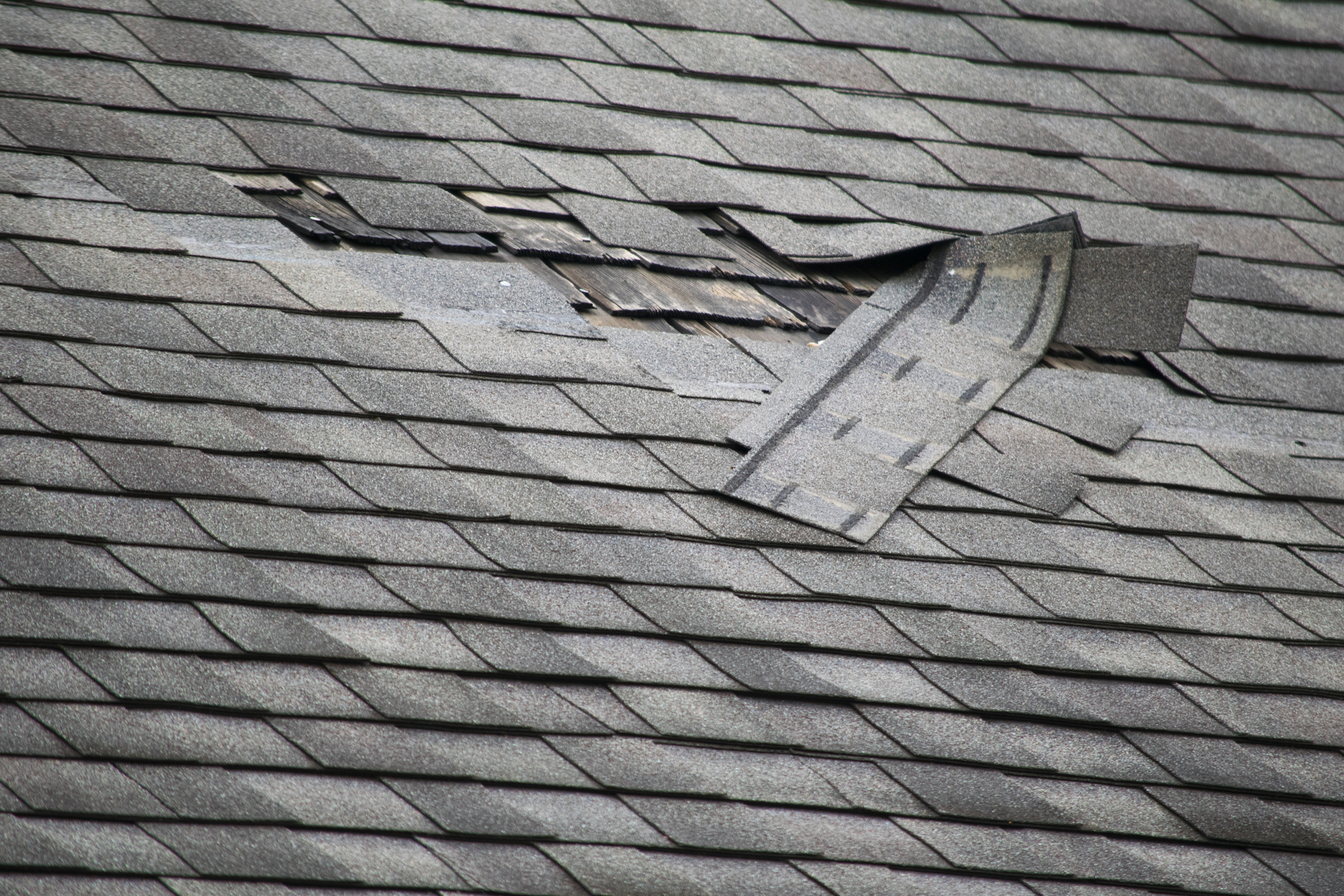 Poor workmanship results in missing shingles on a roof
