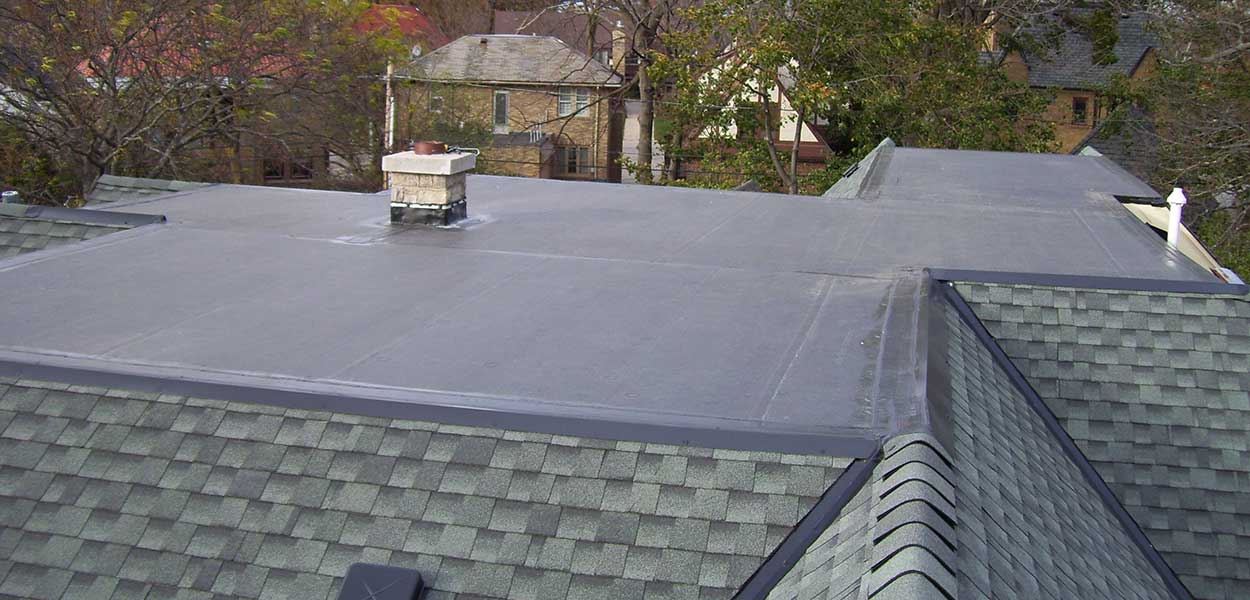 A home with rubber and asphalt roofing installed by L.H. Krueger